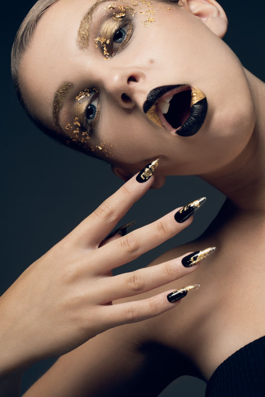 Model with black and gold makeup and nails by Top Notch Art of Makeup