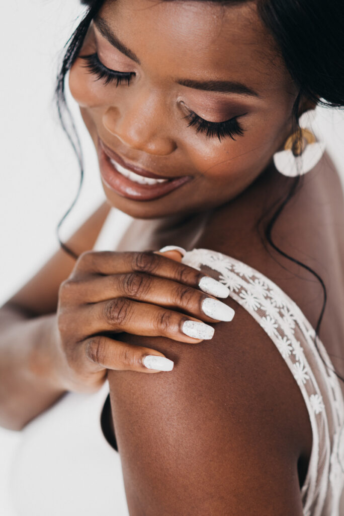 dark skinned bride with natural bridal makeup mauve tones